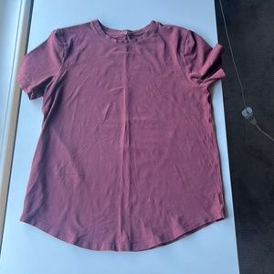 Maroon Lululemon tee shirt. This shirt is a size 2.